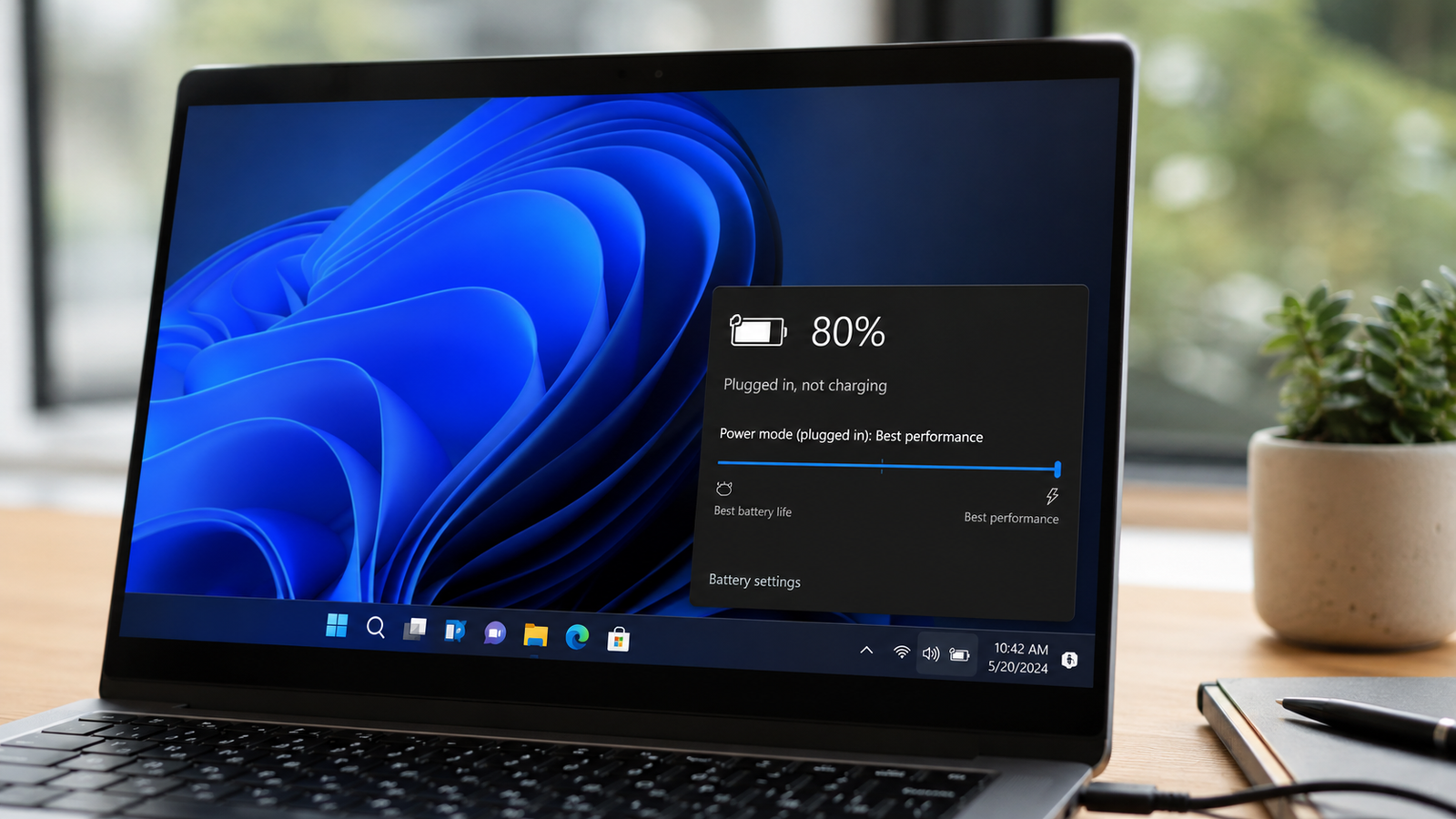 Laptop showing a plugged in not charging warning on the battery indicator
