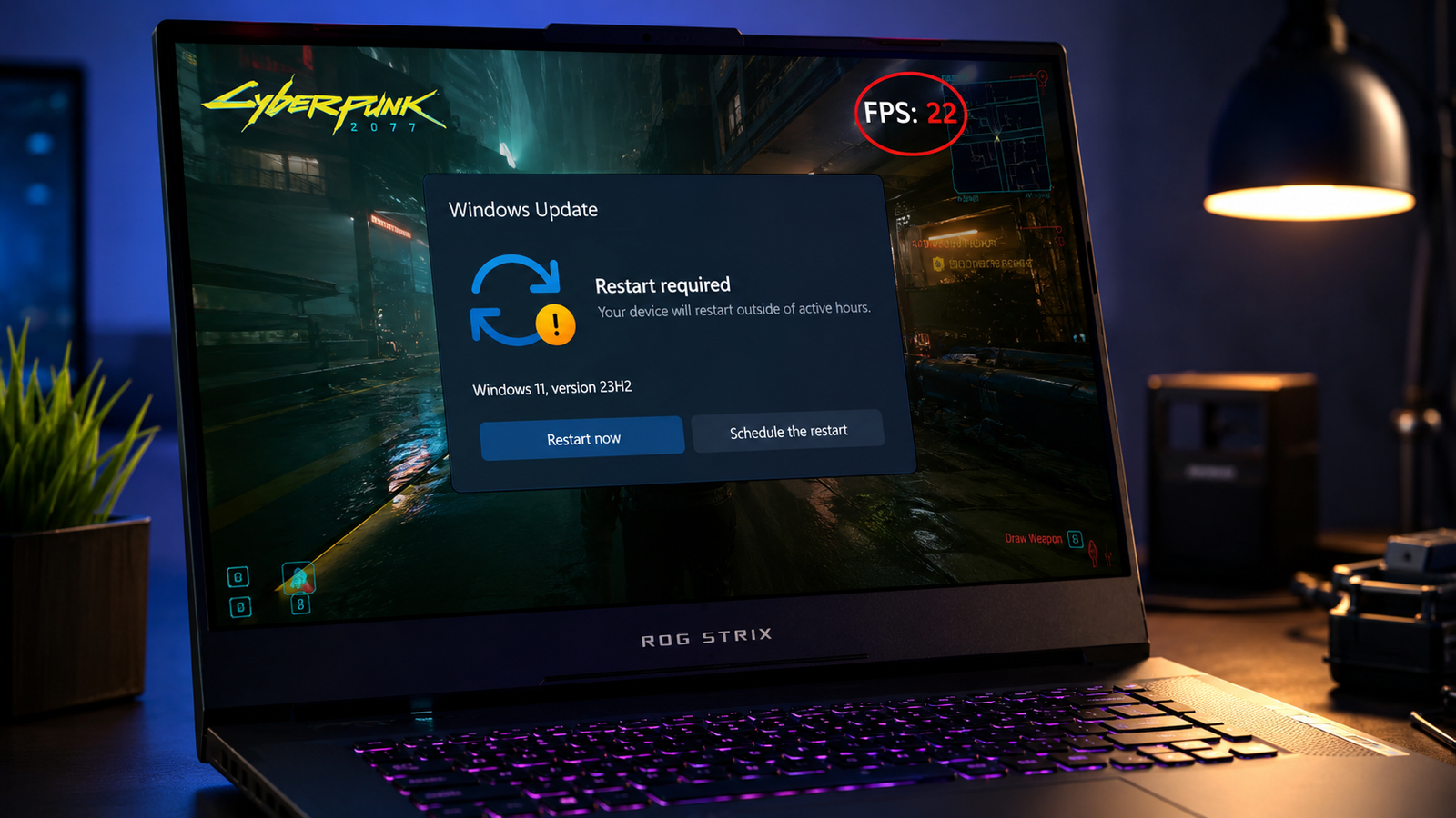 Gaming laptop showing low FPS after a Windows update on a dark tech desk